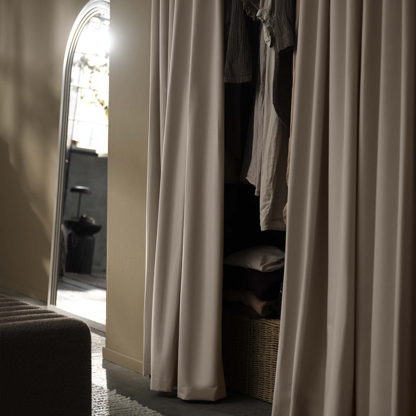 STADSHOLMEN blackout curtain in beige Beige blackout curtain used as decorative fronts for wardrobe in bedroom