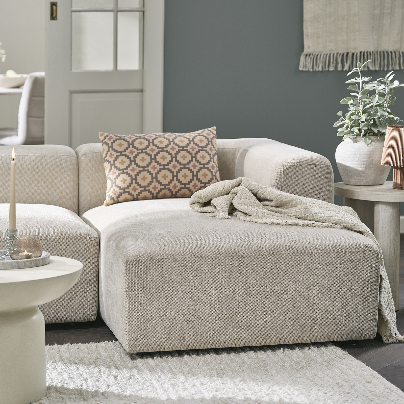 Sofa with a small chaise longue in living room