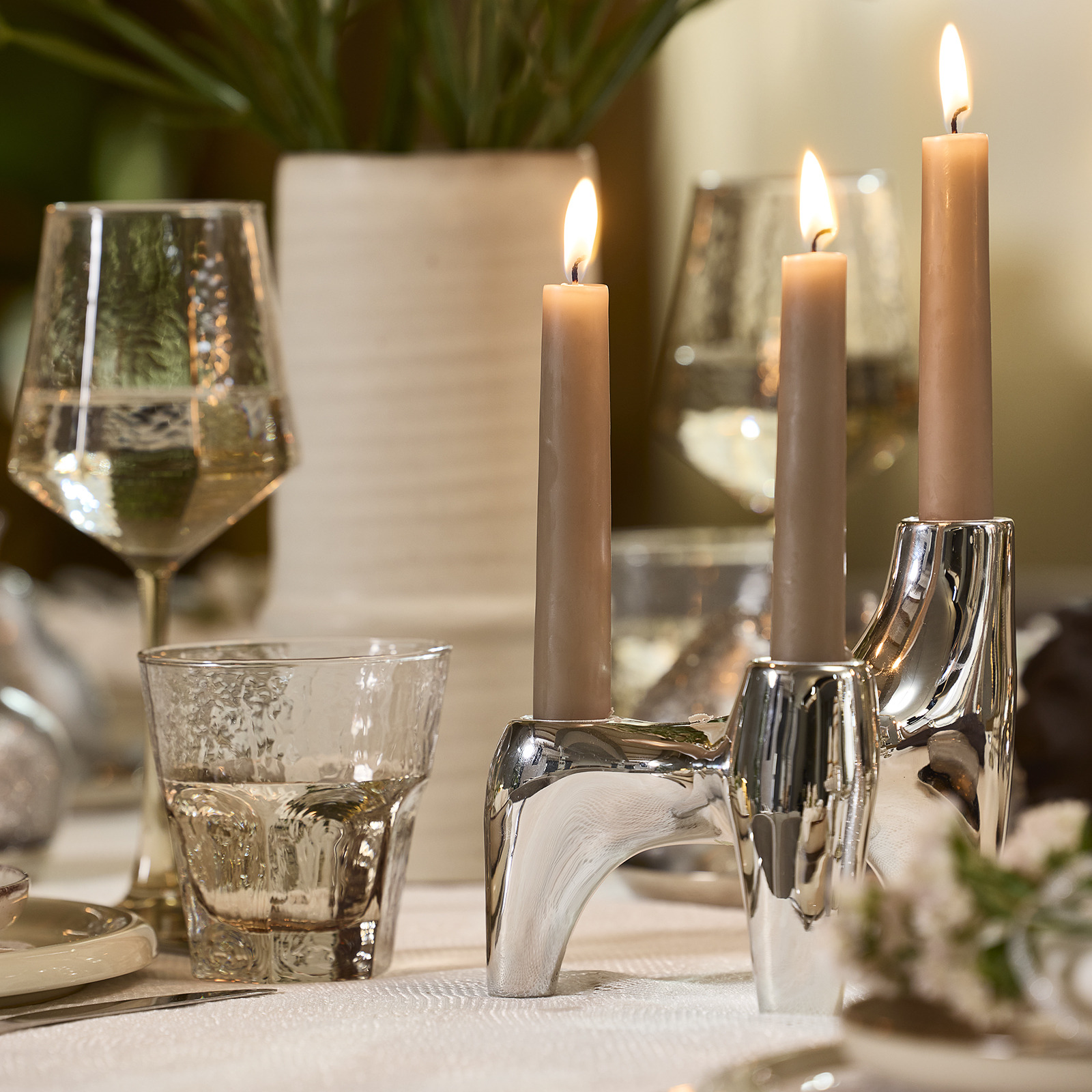 Dinner table with candlestick in a silver colour 