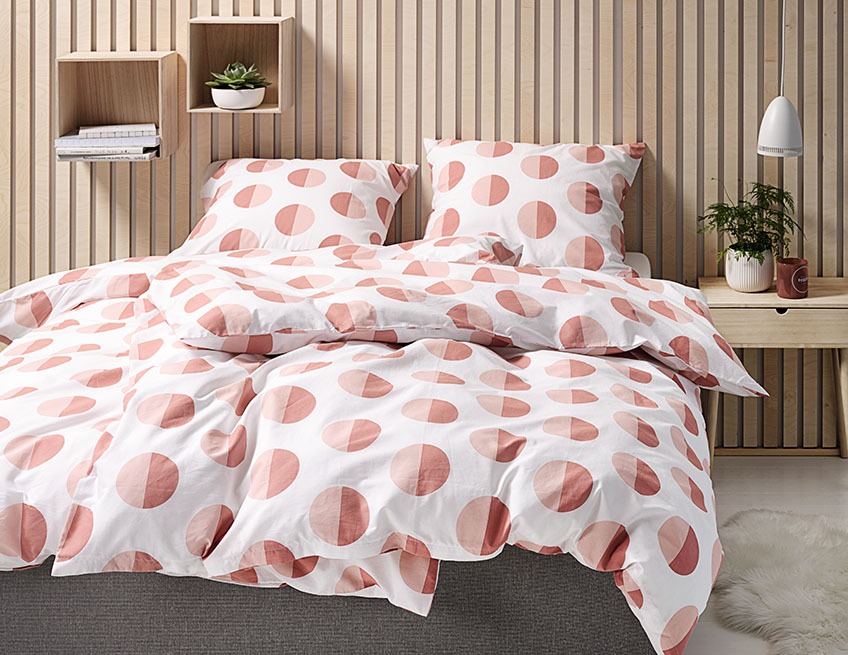 The colourful EMMA bedlinen on a duvet and two pillows Bedroom with bright bedlinen on duvet and pillow