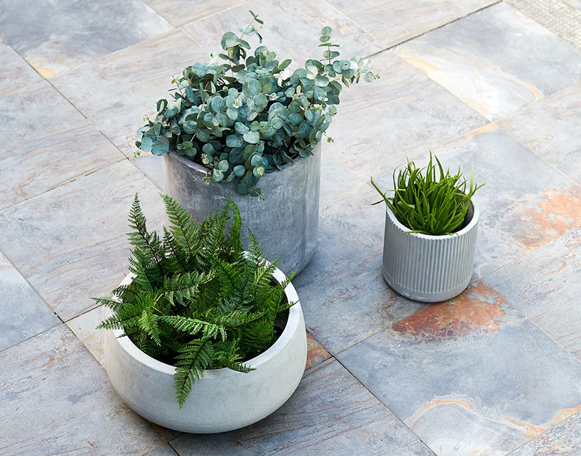 UGGLA, ILDROVFLUE and FLUGA planters Three garden planters on a patio