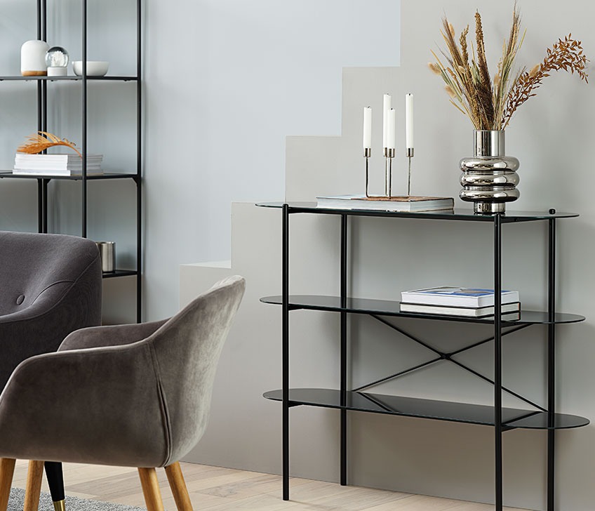 PADBORG bookcase with MAGNUS vase on top Metal bookshelf with stack of books