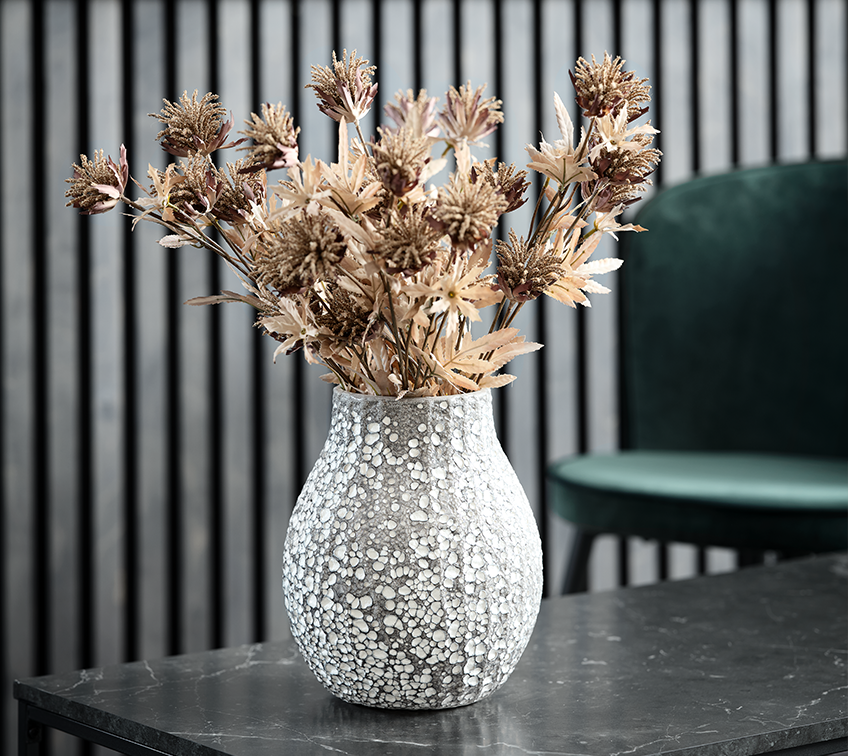 Vase with artificial flower arrangement decorating a living room  