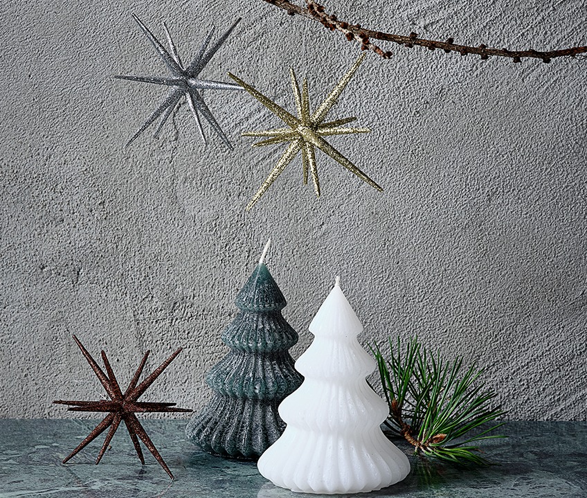 ALMANDIN candles in green or white and ASLAUG Christmas stars in gold, silver, brown or black. Two candles shaped like Christmas trees and Christmas stars in gold, silver and brown.