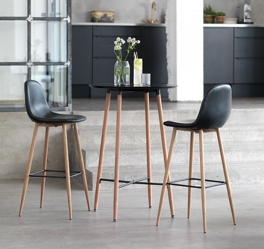 A set of bar stools and table in black and oak   