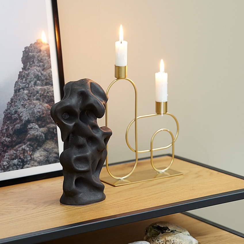 Candlestick in gold-look and black, crooked sculpture 