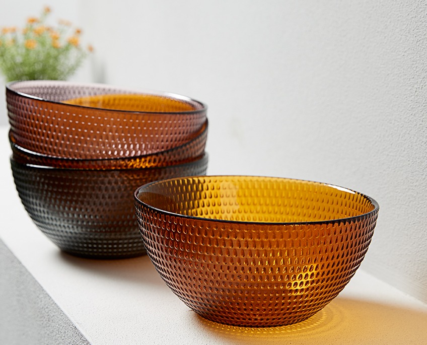 Coloured glass bowls on the step of a staircase