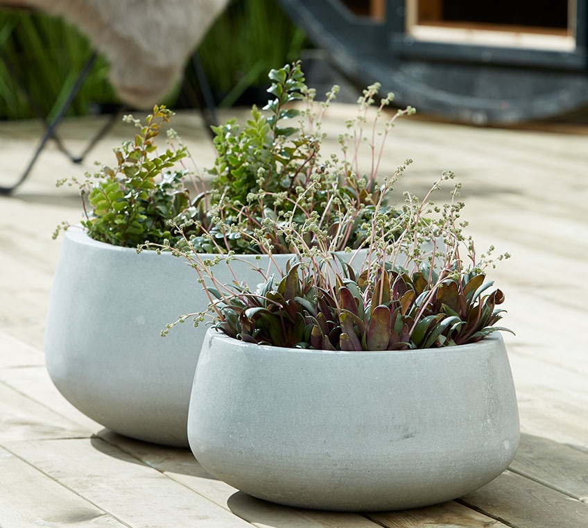 Grey garden planters on a patio
