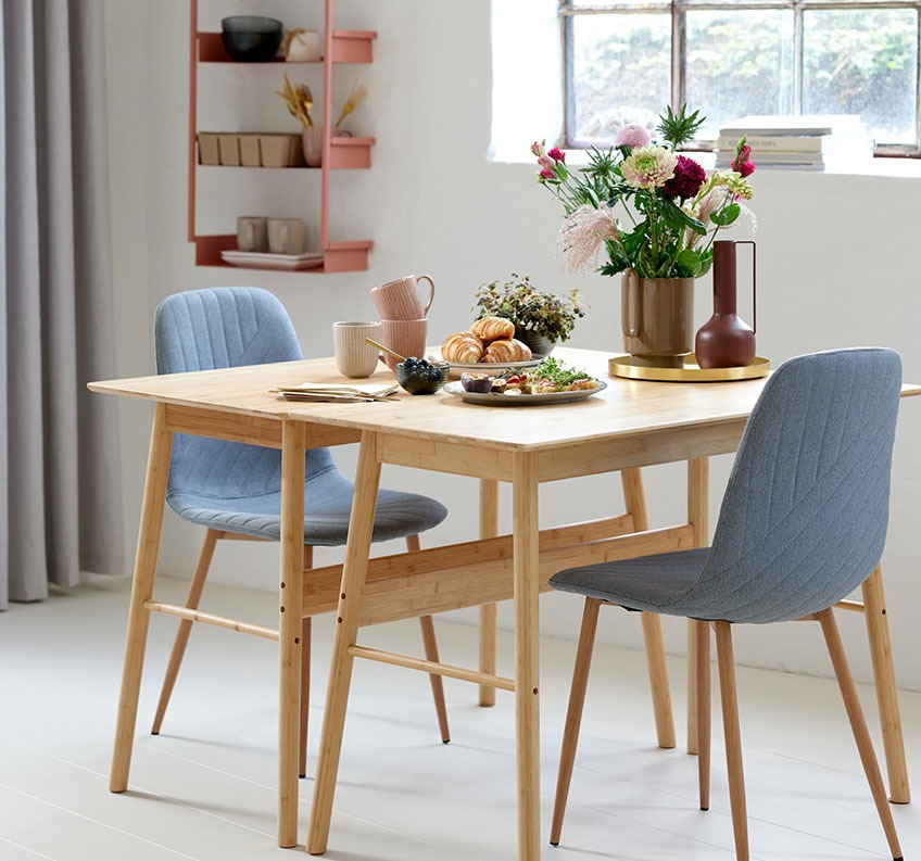 Bamboo desks combined to a dining table and grey dining chairs 