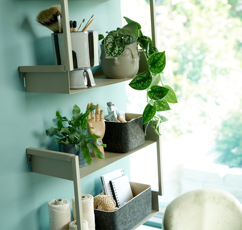 Wall shelves with plant pots and felt baskets 