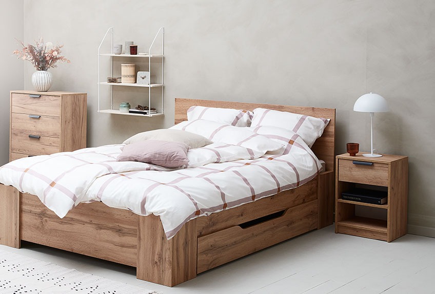 Bedroom with chest of drawers, bed, nightstand and wall shelf 