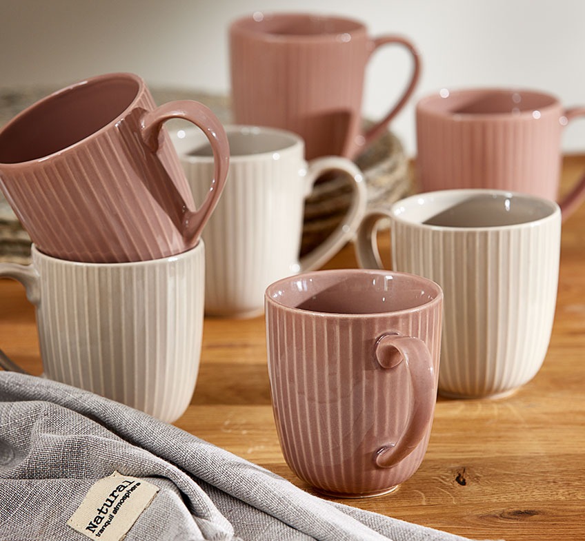 Kitchen table with stoneware mugs 