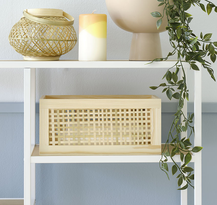 Wood and wicker basket on white console table