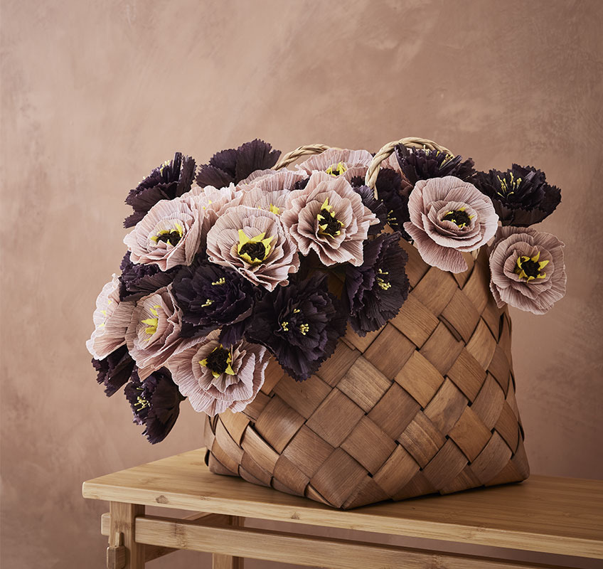 Basket with artificial paper flowers
