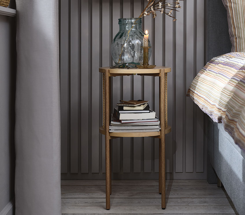 Bedside table with shelf in a bedroom
