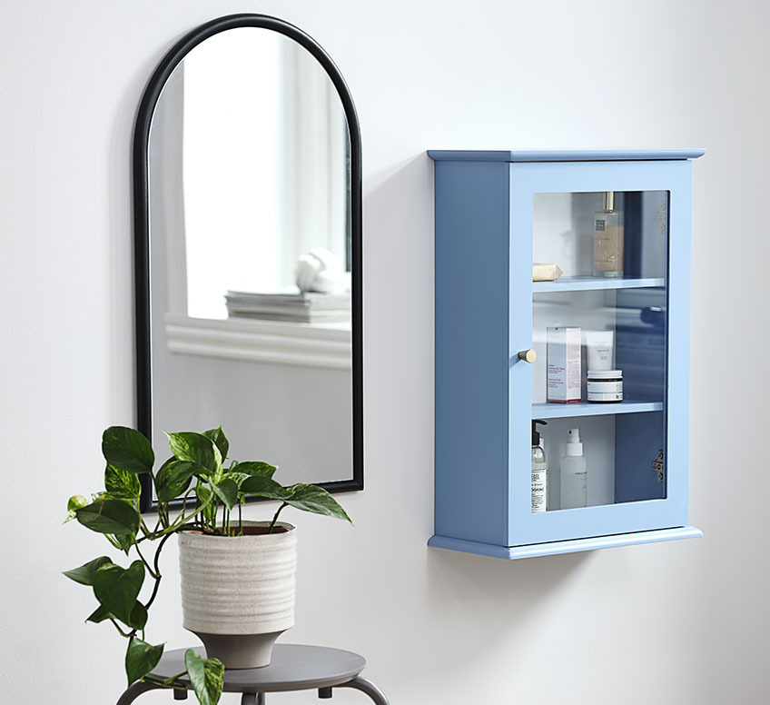 SPANG mirror and MALLING wall cabinet Mirror with black frame next to small wall cabinet