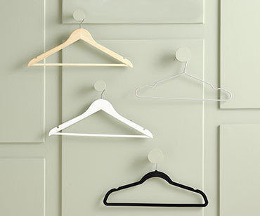 Range of metal and wood hangers in black and white
